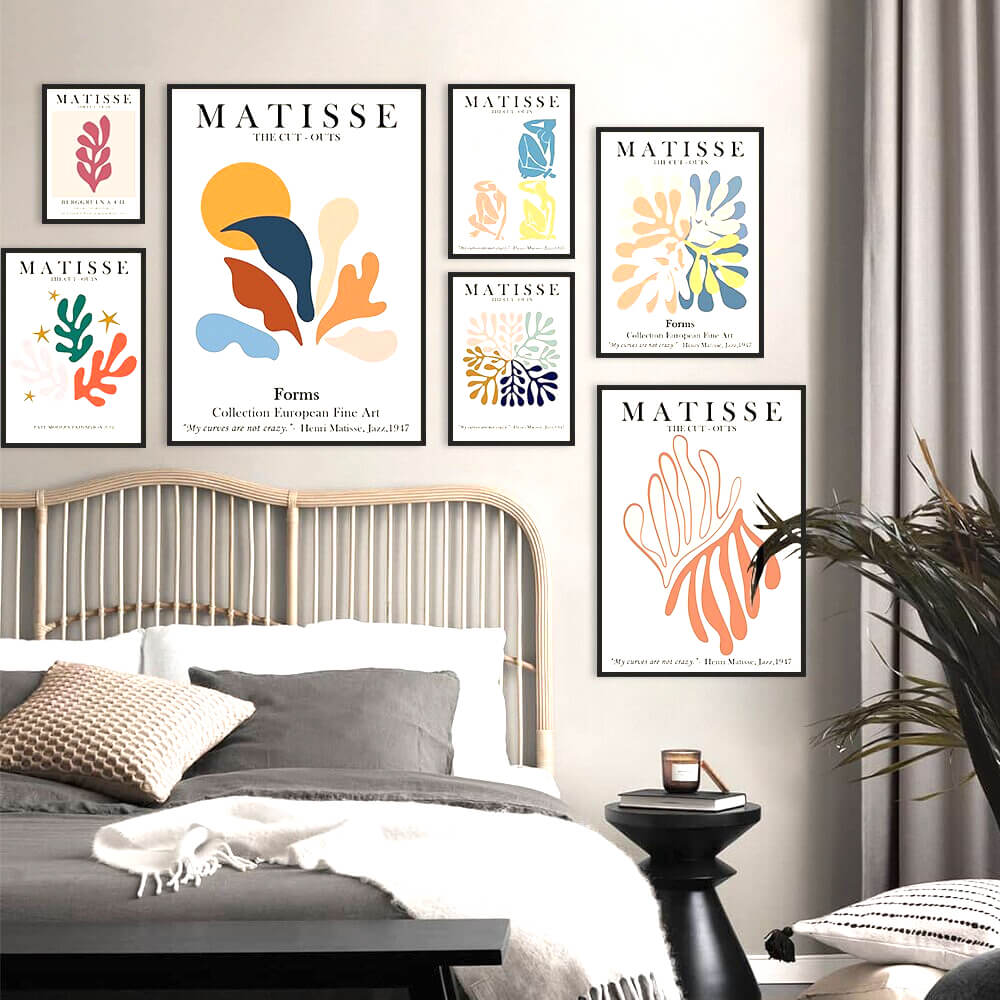 Framed Matisse art above a bed.