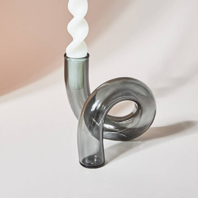 Unique grey glass candle holder with white candle