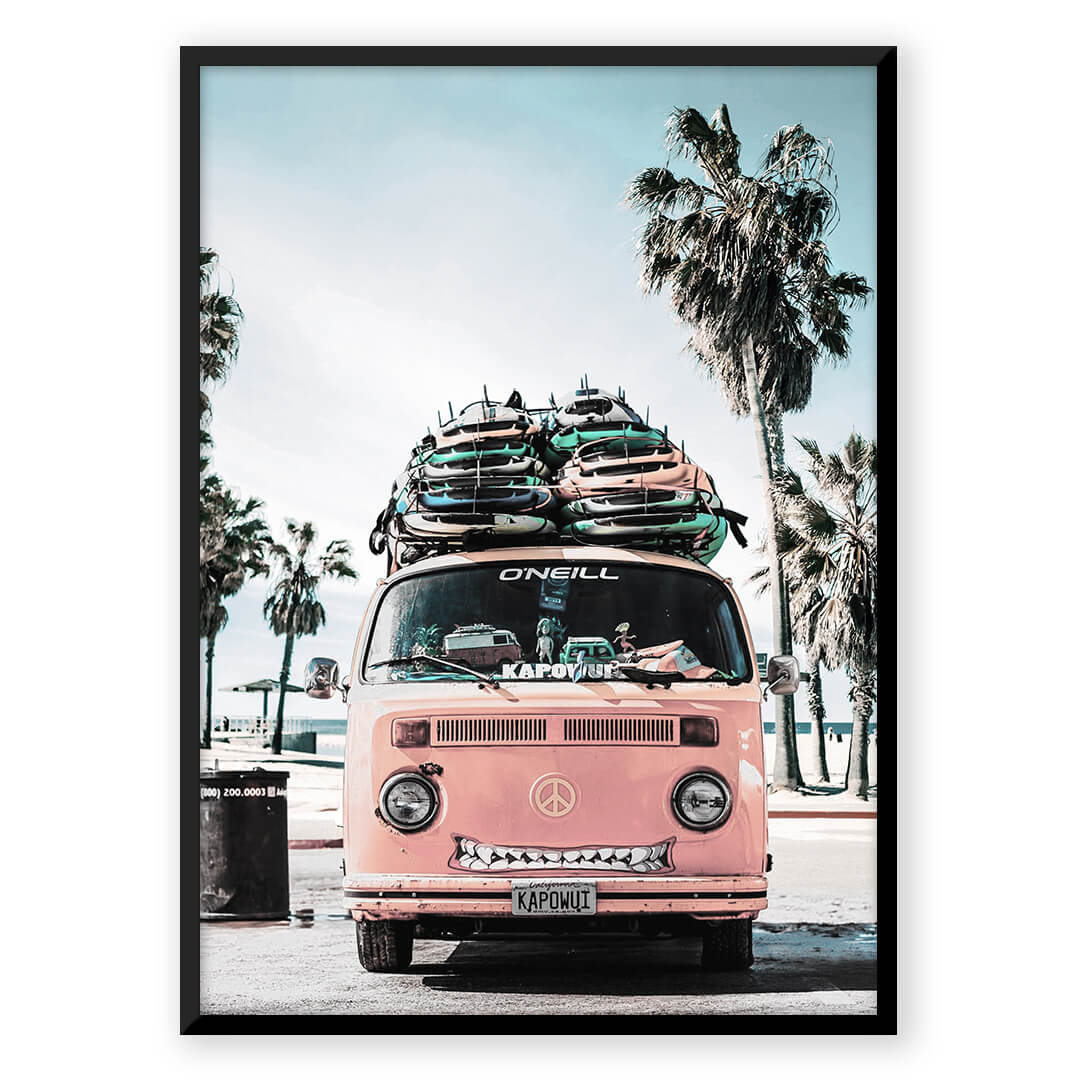Pink surf van on beach with surfboards