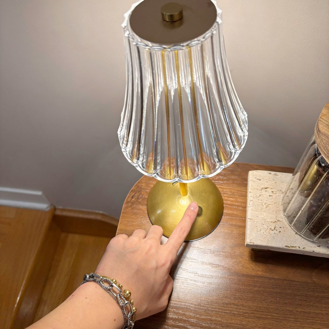 Modern brass table lamp with textured glass shade