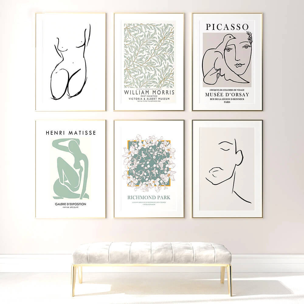 Six framed art prints and a bench.