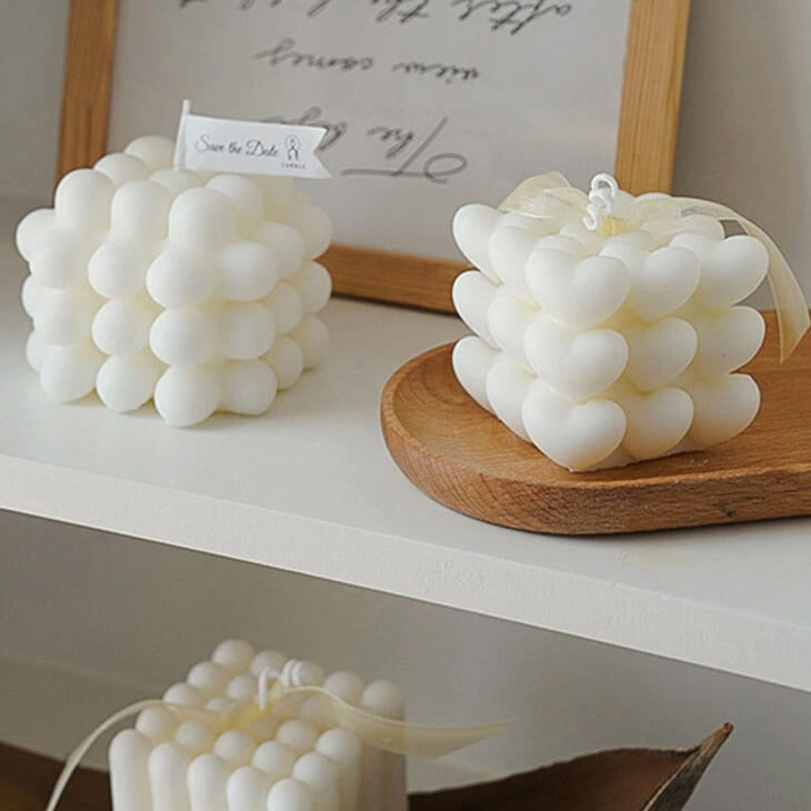 White heart-shaped candles on display