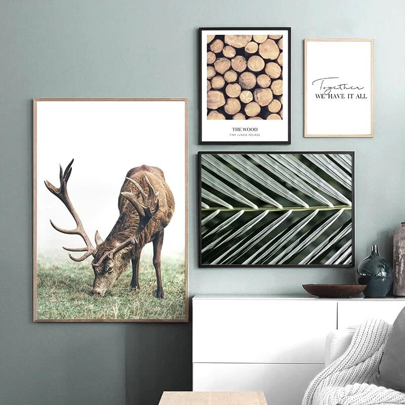 Deer in landscape poster with wood ring and other art.