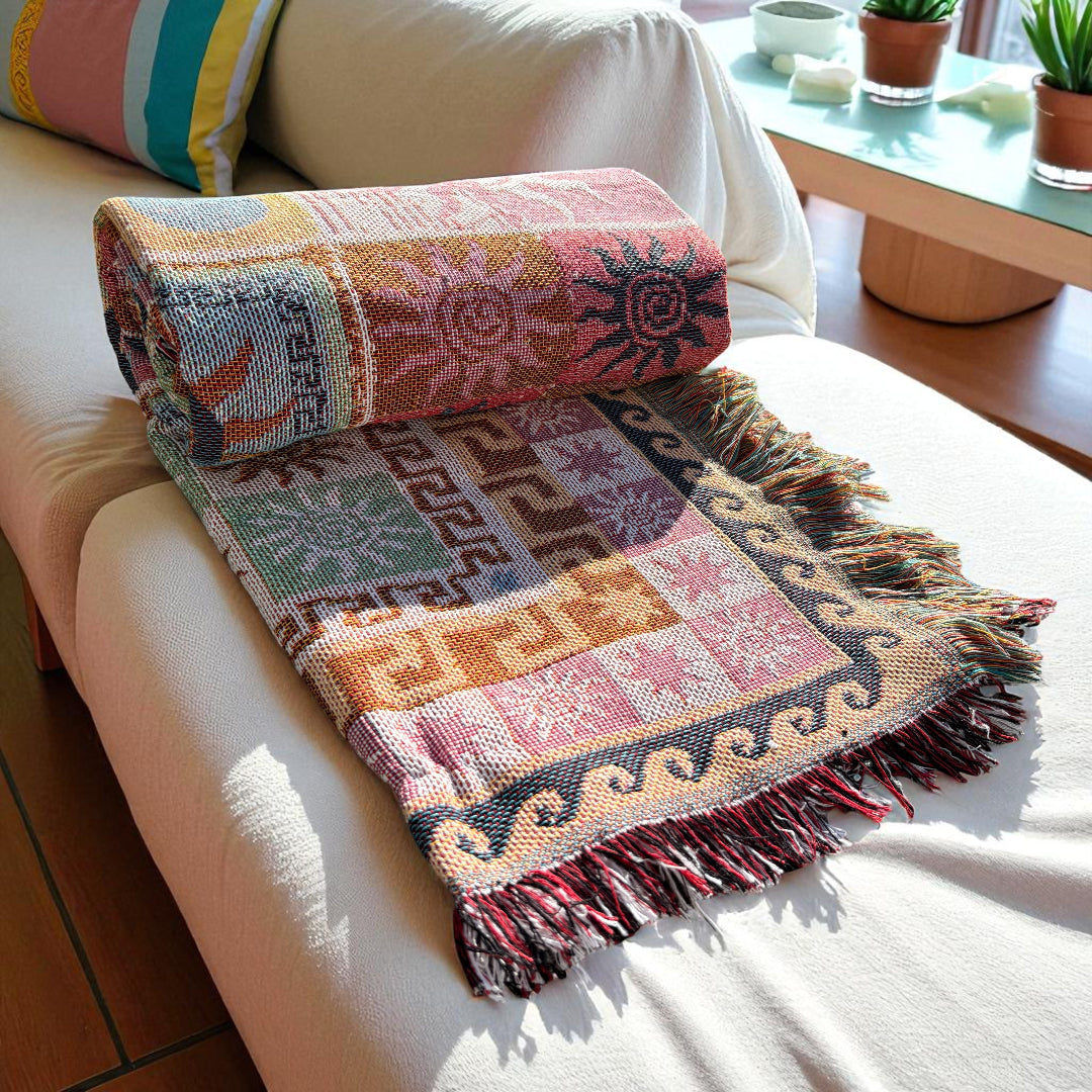 Colorful picnic throw with fringe edges and celestial symbols