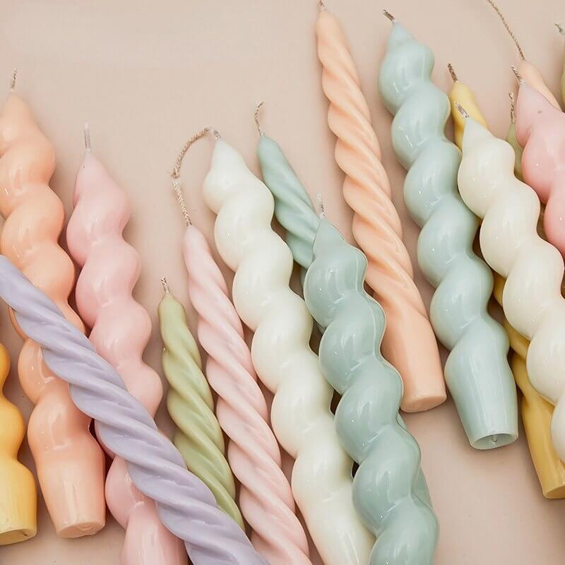 Twisted silicone candle molds with spiral candles