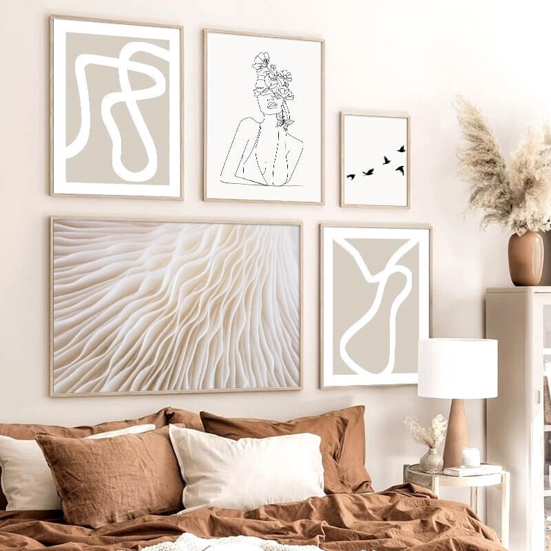 Abstract line art posters in beige bedroom