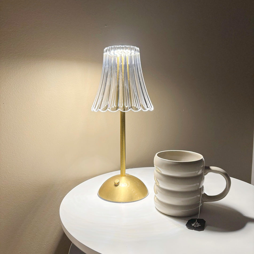 Minimalist table lamp with brass stand and glass shade