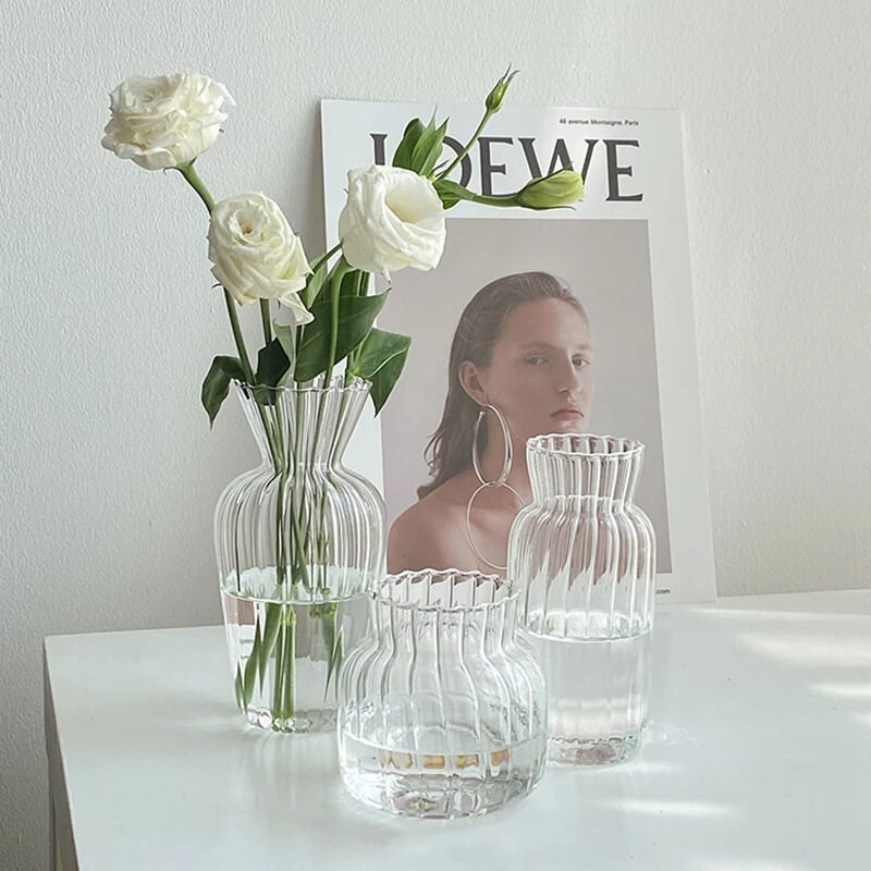 Glass vases with white flowers